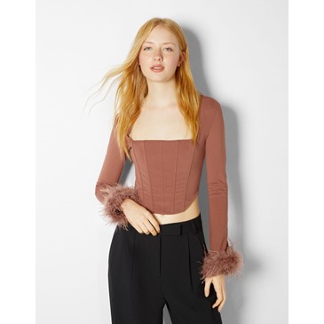 Long sleeve top with feathers