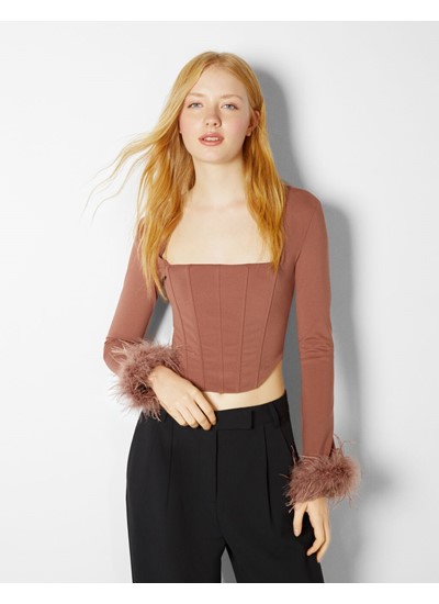 Long sleeve top with feathers