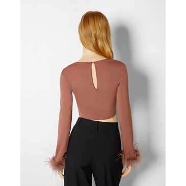 Long sleeve top with feathers